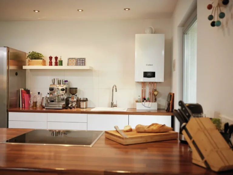 Modern kitchen with white boiler and coffee machine